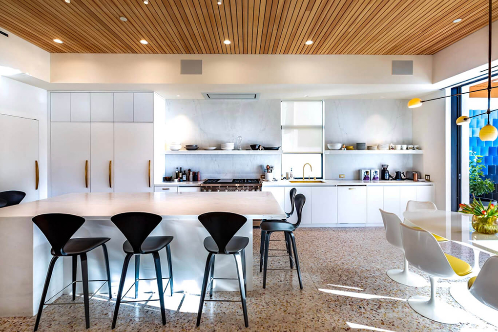chic black and white kitchen with island and counter stools